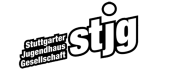 stjg-Logo mit weißer Schrift und schwarzer Umrandung